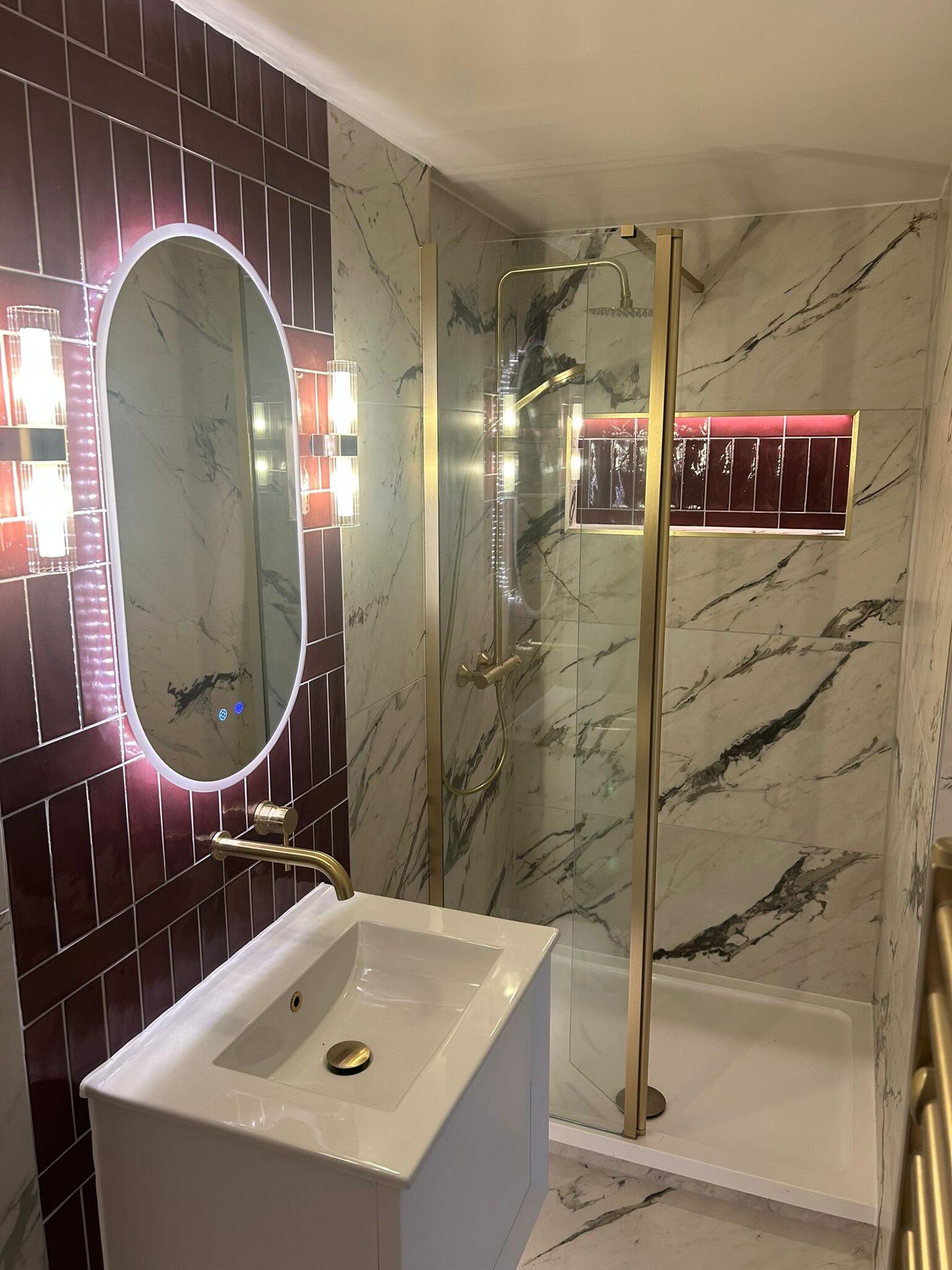 Burgundy and marble shower room with brass fittings, fitted by CDM Plumbing & Bathrooms